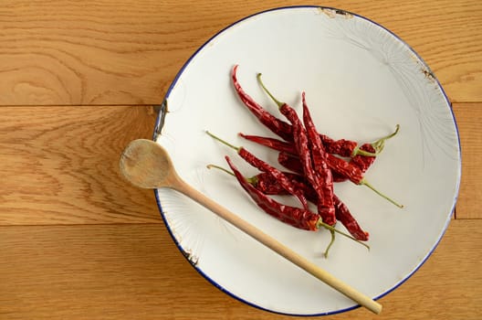 Dried chilies on an old used plate