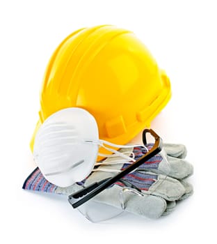 Construction safety equipment with hard hat, respirator, goggles and gloves isolated on white