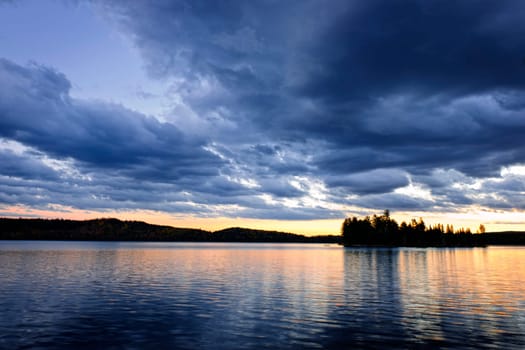 Dramatic sunset at Lake of Two Rivers in Algonquin Park, Ontario, Canada