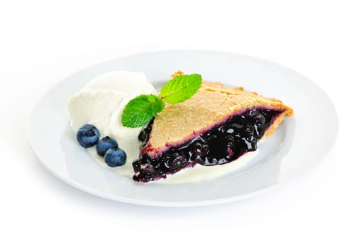 Plate with blueberry pie and vanilla ice cream isolated on white background