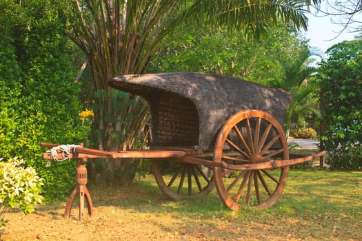 old wooden cart on two wheels in garden