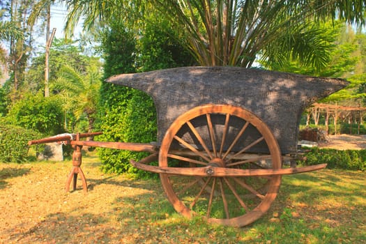 old wooden cart on two wheels in garden
