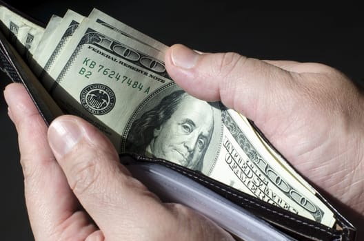 Wallet full of money, concept of wealth.