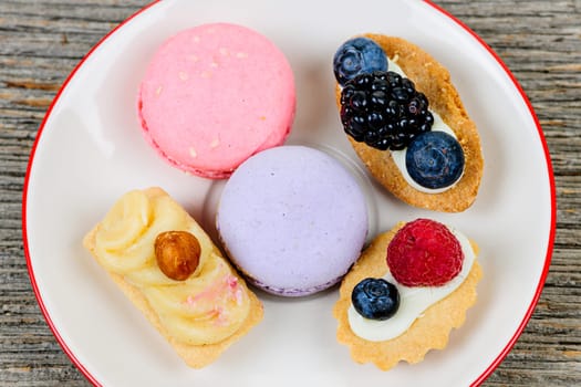 Dessert plate with french macarons and pastries