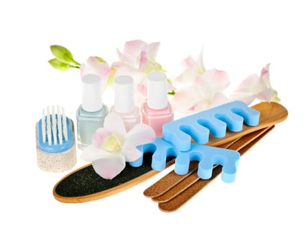 Pedicure accessories and nail polish on white background