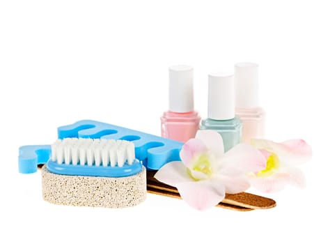 Pedicure accessories with nail polish on white background