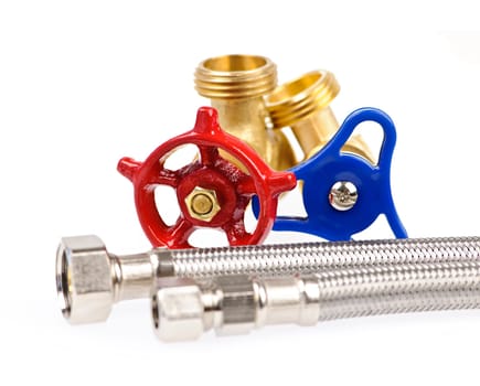Blue and red plumbing valves with metal hoses