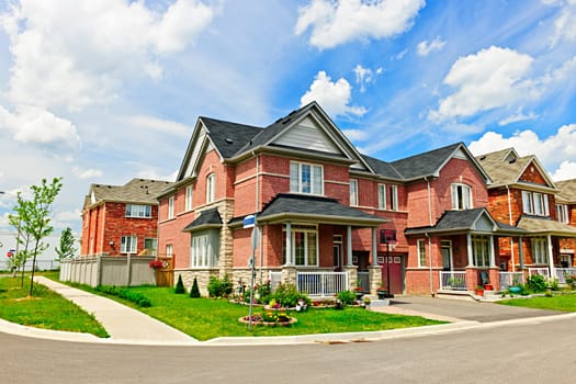 Suburban residential street with red brick houses