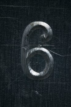 Macro image of a number in metal X