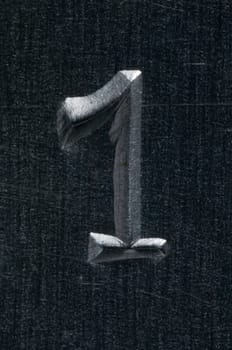 Macro image of a number in metal X