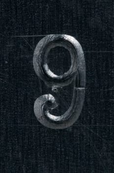Macro image of a number in metal X