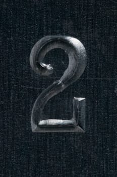 Macro image of a number in metal X