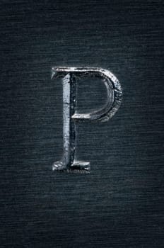 Macro image of the letter "P"" in metal"