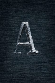 Macro image of the letter "A"" in metal"