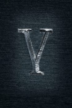 Macro image of the letter "Y"" in metal"