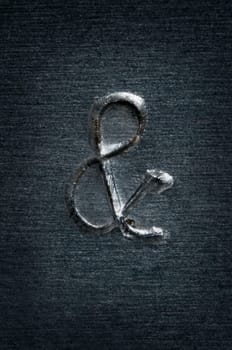 Macro image of the letter "&"" in metal"
