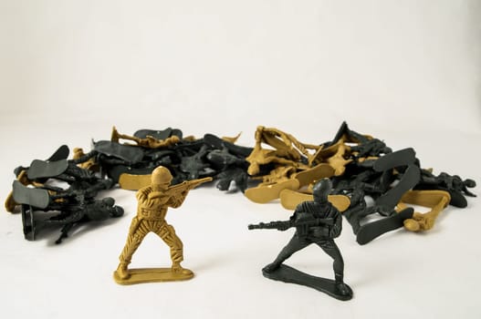 Plastic Lead Soldiers Representing War on a White Background