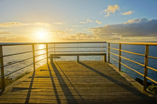 HDR Picture Sunrise on a Pier over Atlantic Ocean in Tenerife Canary Islands Spain