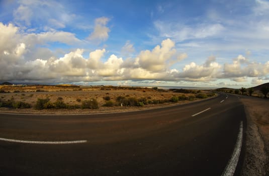 Long Empty Desert Road on a Cludy Day