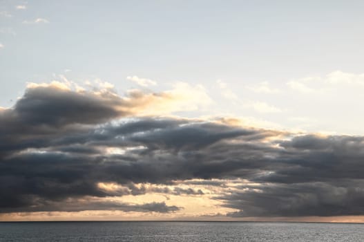 Cloudscape, Colored Clouds at Sunset near the Ocean