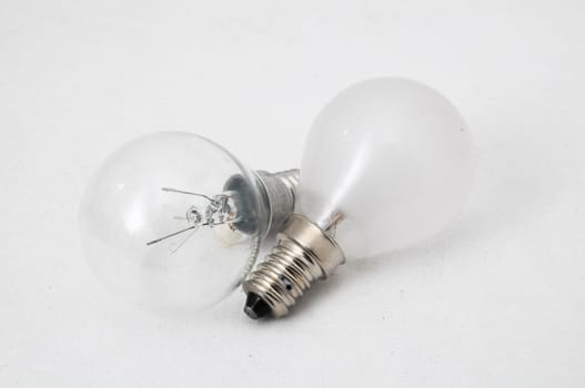 Two Different Old Incandescent Light Bulbs on a White Background