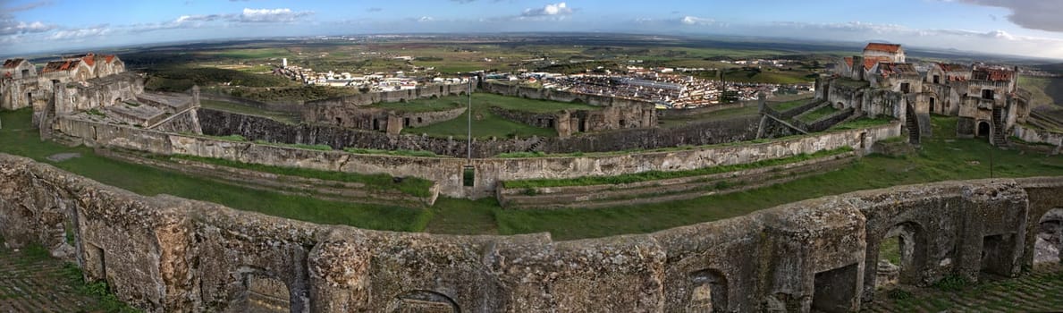 View of the Fortress of Nossa Senhora da Graca and adjacent hills and olive groves in Elvas, Portugal