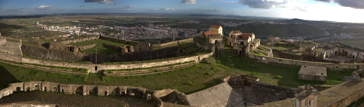 View of the Fortress of Nossa Senhora da Graca and adjacent hills and olive groves in Elvas, Portugal