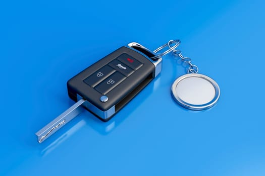 Car key with metal keyring on blue shiny background