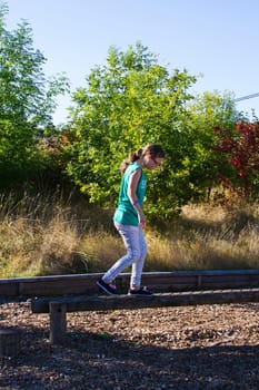 Young girl on balance beam