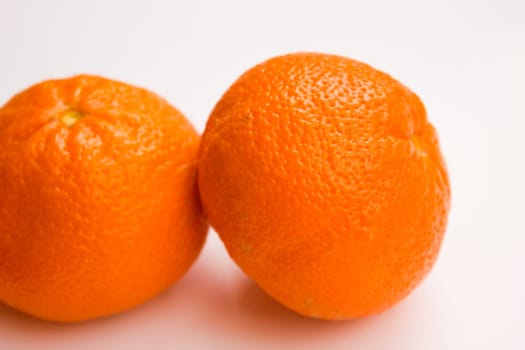 Vibrant mandarin fruit on a white background.