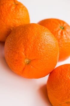 Vibrant mandarin fruit on a white background.