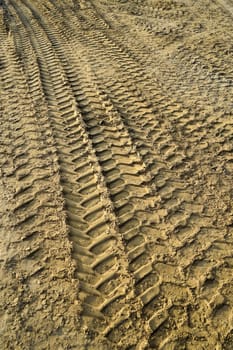 Tire tracks in the sand of a construction site