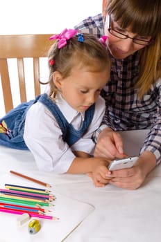 mother and daughter with mobile phone