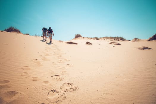 Senior couple walking up a hill.personal editting