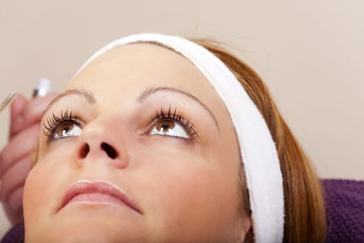 Young woman looks with wide open eyes