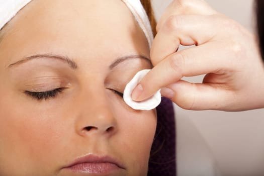 Eyelashes are cleaned with cotton pad