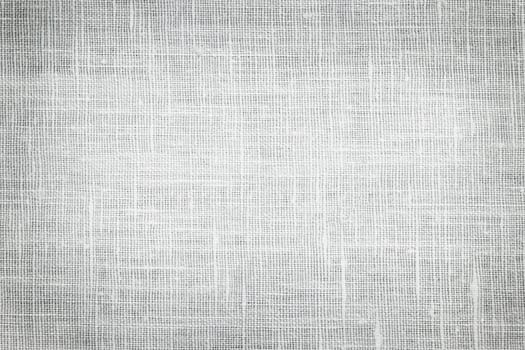 White linen woven fabric background or texture with dark vignette