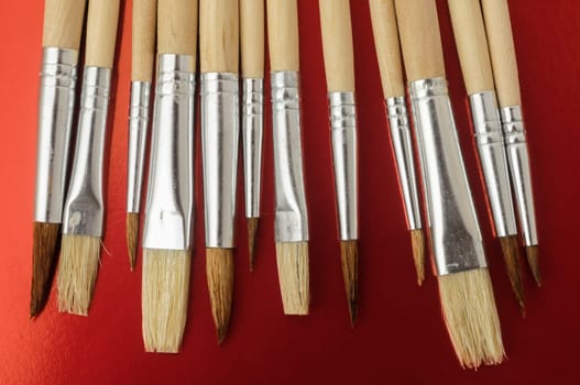New Wooden Different Paintbrush Set Texture over a Colored Background