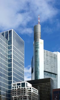 Frankfurt,Germany – February 19,2014: The commerzbank skyscraper between office buildings on 19 February 2013 in Frankfurt.