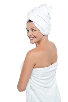 After shower beauty cheerfully turning back and looking at camera