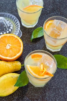 Lemonade in glazes of fresh lemons and oranges with ice cream