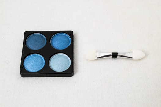 Make-up Palette Of Colorfully Eyeshadows Over White Background