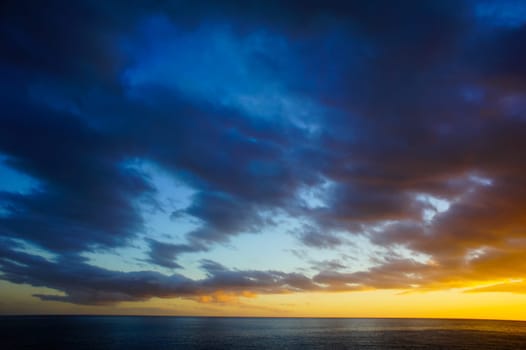 Cloudscape, Colored Clouds at Sunset near the Ocean