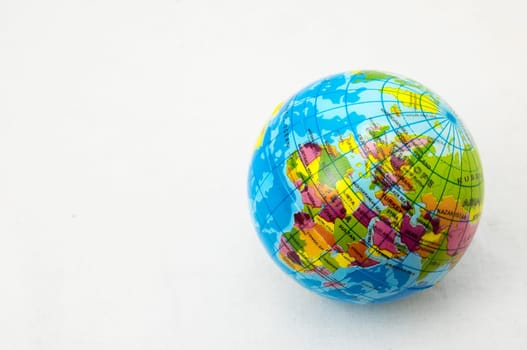 The World Globe Made of Rubber on a White Background