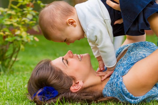 Enjoying life - happy mother with child.