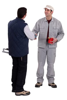 Two manual worker stood together