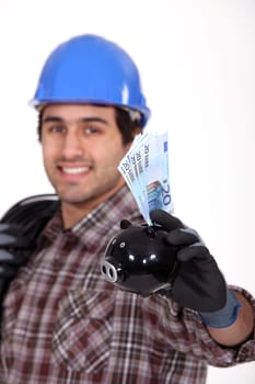 Entrepreneur showing piggy bank