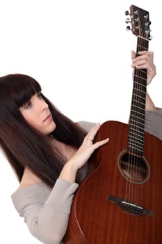 Woman with an acoustic guitar