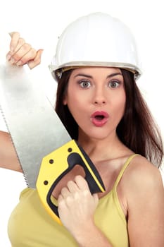 Surprised woman with a handsaw