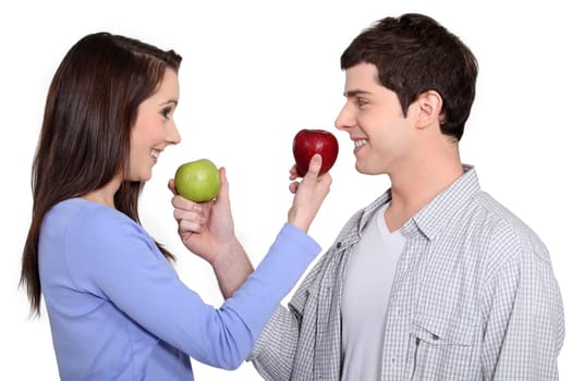 Couple exchanging apples